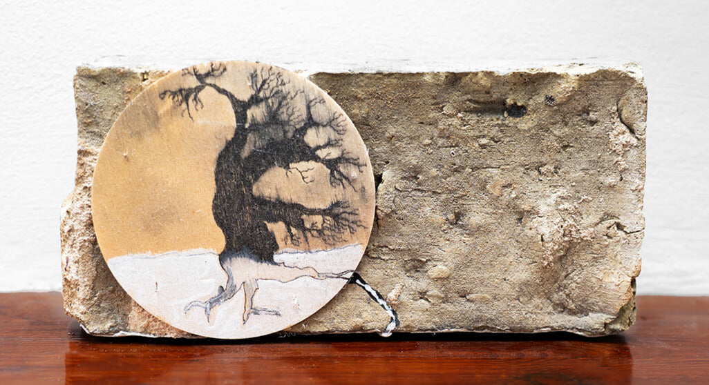 brick based artwork with plate